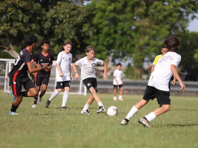 Youth development players in action during a friendly