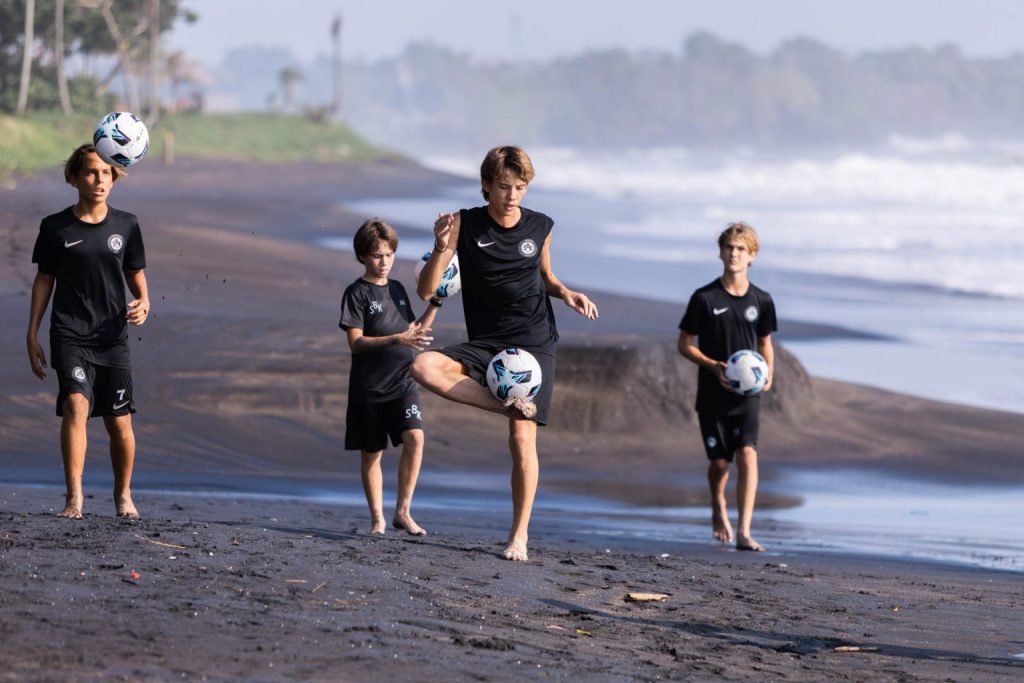 Youth development soccer players practicing their skills in Bali
