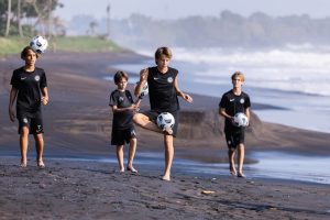 Youth development soccer players practicing their skills in Bali
